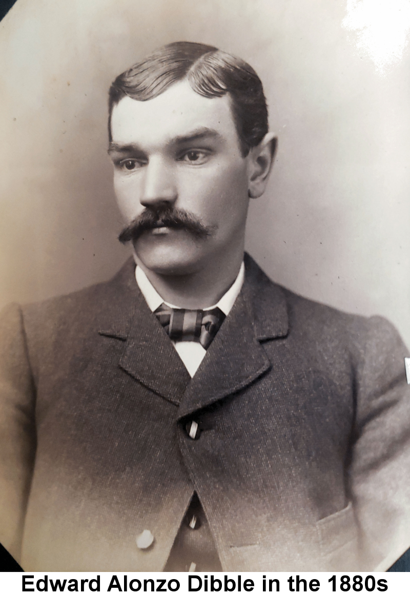 IMAGE/PHOTO: Edward Alonzo Dibble in the 1880s: Black and white studio portrait photo of a young man with straight hair, parted on the left, and a handlebar moustache, in a suit jacket and bow tie.